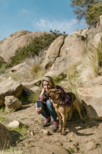 Woman Taking a Picture with a Dog
