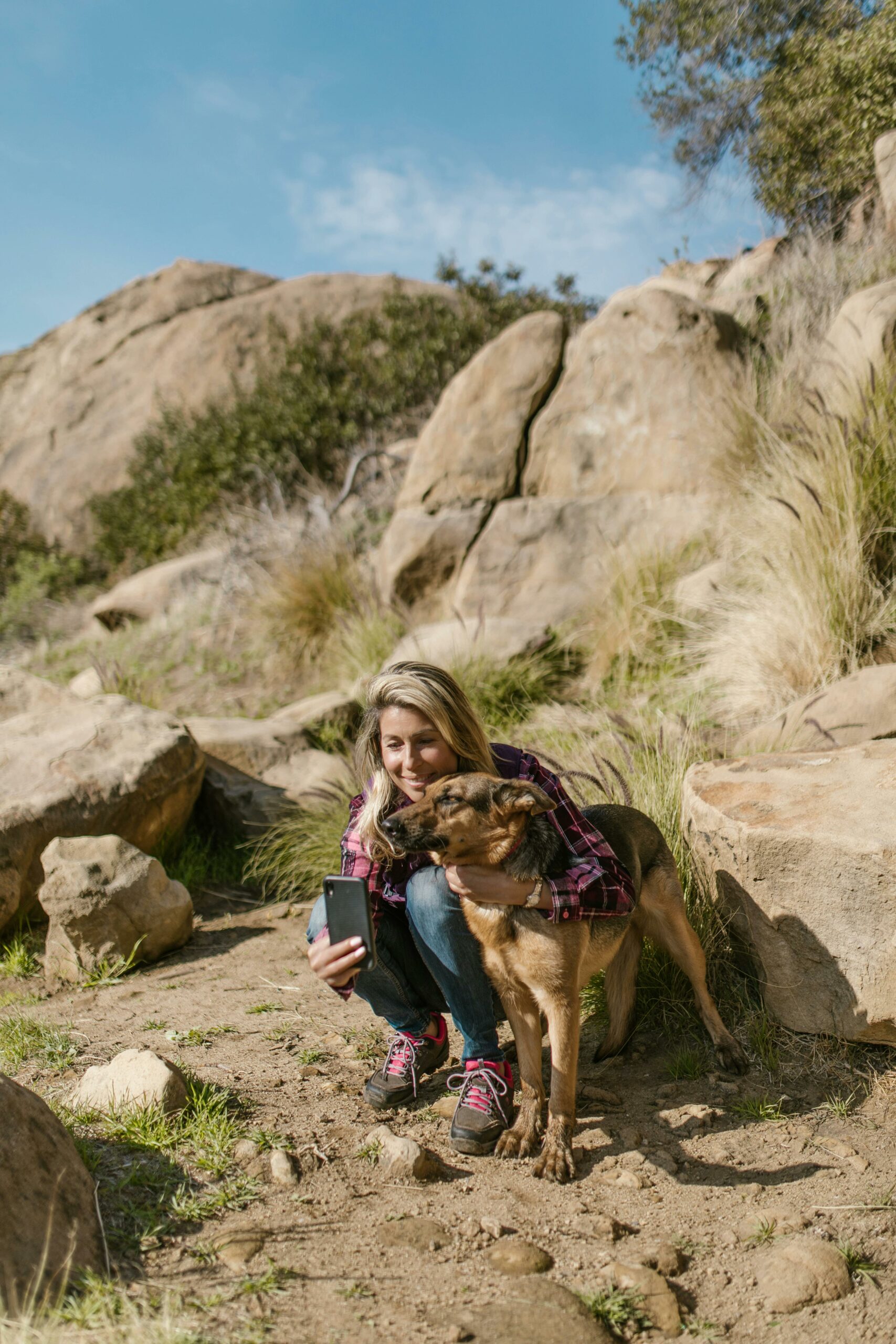 Woman Taking a Picture with a Dog